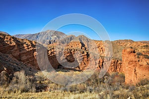 Beautiful view of cliffs from yellow red limestone. Kyrgyzstan