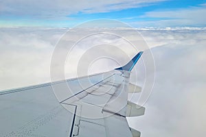 Beautiful view of the clouds from the window of the flying plane