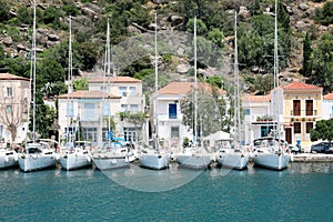 Beautiful view of coastal city with sailboats on sunny day