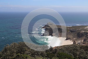 Beautiful view of coastal cliffs and blue sea. Cape of Good Hope, South Africa.