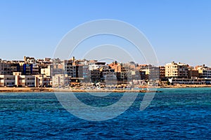 Beautiful view of coastline with houses and hotels in Hurghada, Egypt. View from Red sea