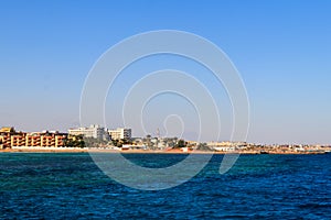 Beautiful view of the coastline with houses and hotels in Hurghada, Egypt. View from Red sea