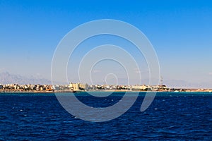 Beautiful view of coastline with houses and hotels in Hurghada, Egypt. View from Red sea