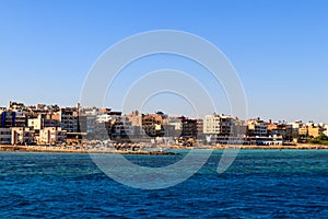 Beautiful view of coastline with houses and hotels in Hurghada, Egypt. View from Red sea