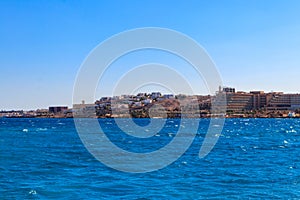 Beautiful view of the coastline with houses and hotels in Hurghada, Egypt. View from Red sea