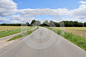 Beautiful view on countryside roads with fields and trees in northern europe