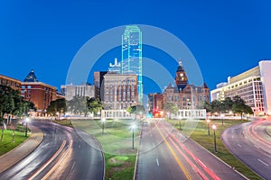 Skyline and light trail traffic over Dealey Plaza in Dallas, Tex photo