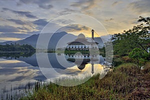 Beautiful view of Darul Quran Mosque with reflections during sunrise