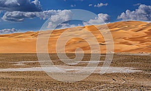 A beautiful view of a desert Vally with nice and clean sand dunes an blue sky, f