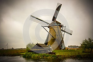 Beautiful view of the dutch windmill in Kinderdijk in the gloomy day