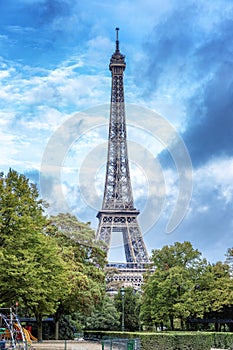 Beautiful view of the Eiffel Tower against a bright blue sky on a sunny day.