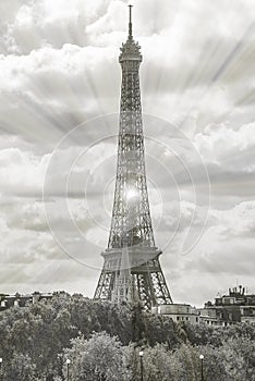 Beautiful view of Eiffel Tower against the white clouds on the blue sky on sunny summer day