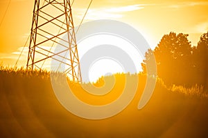 Beautiful view of electrical tower silhouette at country sunset