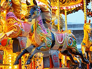 Beautiful view of the evening carousel, where there is a horse with interesting colors