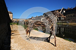 A Beautiful view of the famous Old Bridge Ponte Vecchio with blue sky in Florence as seen from Arno river