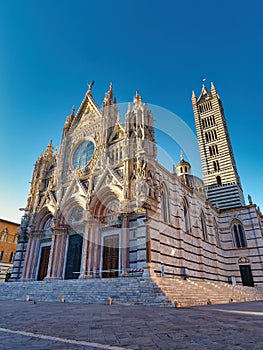 Beautiful view of Famous Piazza del Duomo with historic Siena Cathedral, Tuscany, Italy