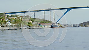 Beautiful view of famous Queen Juliana Bridge. Gorgeous ocean landscape on blue sky background.