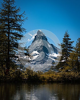 Beautiful view of the famous Riffelsee Lake in snow-capped Matterhorn mountains in Switzerland