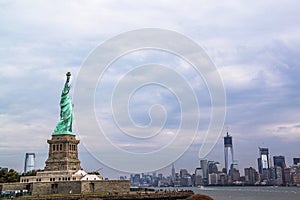 Beautiful view of famous Statue of Liberty and Manhattan on background.  Liberty Island in New York Harbor in New York