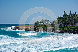 Beautiful view of the Fig Tree Bay Peninsula with big waves on the foreground. Protaras city, Cyprus