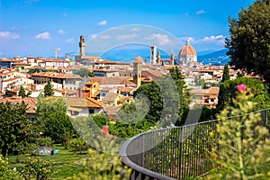 Beautiful view on Florence through green garden. Italy cityscape with Firenze Duomo