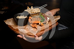 beautiful view of french fries and bowl of sauerkraut and delicious batter fried pork ears