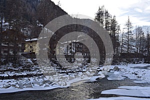 Icy river flowing through the Otztal Valley in Solden Alpine resort photo