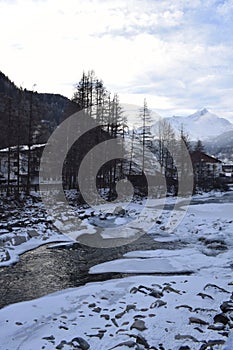 Icy river flowing through the Otztal Valley in Solden Alpine resort photo