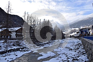 Icy river flowing through the Otztal Valley in Solden Alpine resort photo