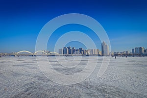 Beautiful view of frozen Songhua river during winter time in Harbin, China photo