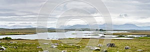 Beautiful view of Glenicmurrin Lough lake in Connemara region in Ireland. Scenic Irish countryside landscape with mountains on the