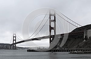 Beautiful view of the Golden Gate Bridge, San Francisco under foggy gray sky