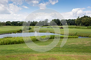 Beautiful view on golf course with perfect grass and pond