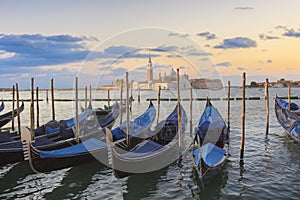 Beautiful view of the gondolas and the Cathedral of San Giorgio Maggiore, on an island in the Venetian lagoon, Venice, Italy