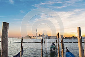 Beautiful view of the gondolas and the Cathedral of San Giorgio Maggiore, on an island in the Venetian lagoon, Venice, Italy