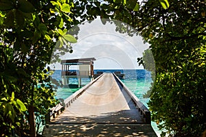 Beautiful view from the grass arch of overwater villas in the Maldives