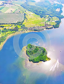 Beautiful view of the green island surrounded by a lake