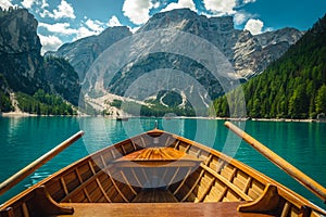 Beautiful view with high mountains from the wooden rowing boat