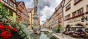 Beautiful view of the historic town of Rothenburg ob der Tauber with fountain, Franconia, Bavaria, Germany