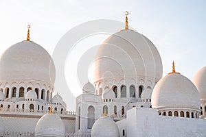 Beautiful view of historical Sheikh Zayed Grand Mosque in Abu Dhabi, UAE during sunset