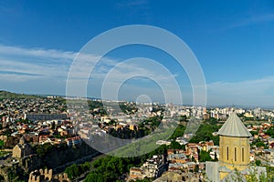 Beautiful view of the houses on the edge of the cliff on the Kura river in Tbilisi