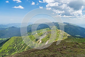 A beautiful view from Hoverla in the Carpathians to the mountains against the background of the sky. Ukraine.