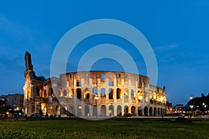 Beautiful view of illuminated Colosseum in the evening. Rome, Italy.