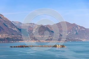 Beautiful view of the Island Isola Borghese Cavazza on Lake Garda on a sunny autumn day