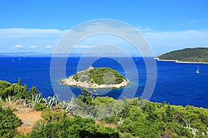 Beautiful view from island Vis to blue Adriatic sea and islet Host, Dalmatia, Croatia