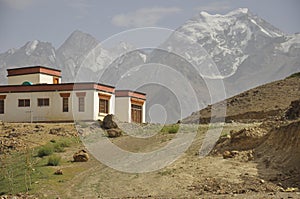 Beautiful view of a Ladakhi house with glacier view in the background in Padum, Zanskar Valley, Ladakh, INDIA