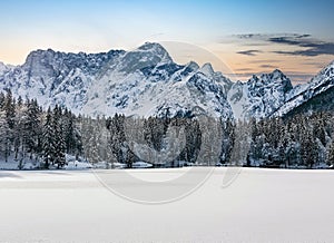 Beautiful view of the Laghi di Fusine lakes near Tarvisio in Italy on a white winter day