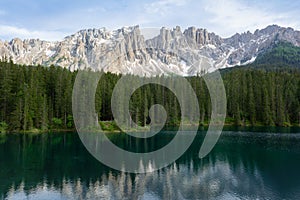 Beautiful view of Lago di Carezza with mountain reflections in the water, Italy