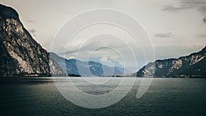 Beautiful view of a lake and mountains in the background in cloudy weather.