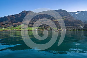 Beautiful view of Lake Walensee (Lake Walen or Lake Walenstadt) with mountain range in background. Switzerland, Europe